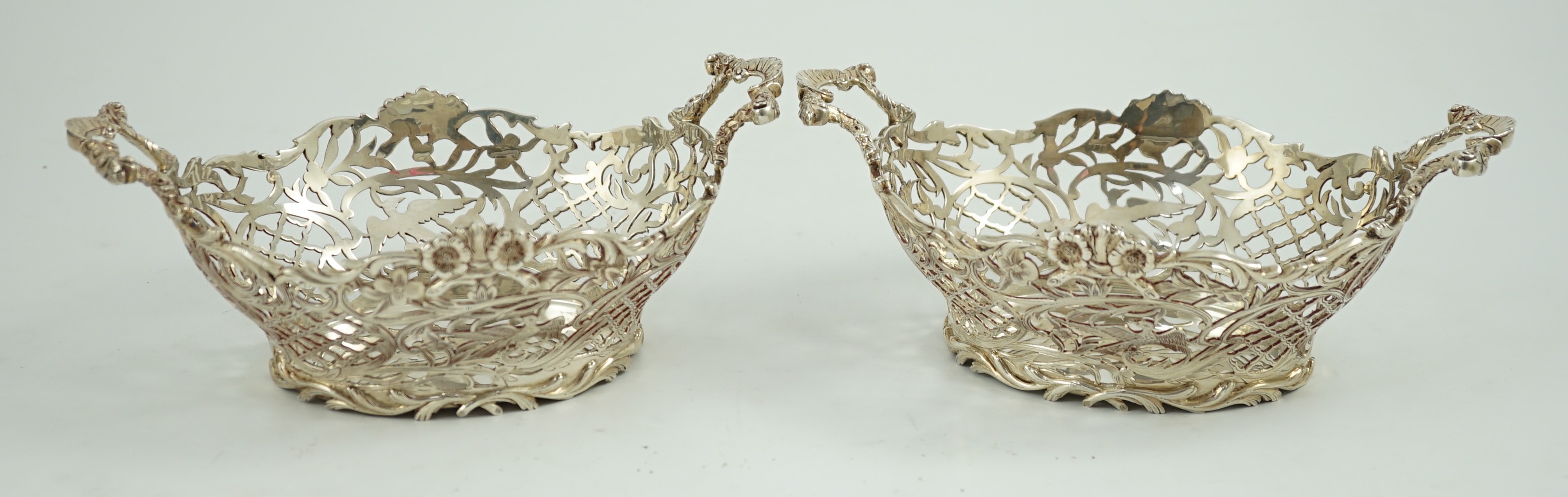 A pair of Edwardian pierced silver two handled bon bon dishes, by William Comyns
